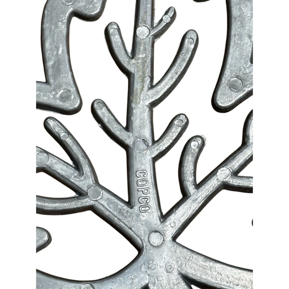 Copco cast aluminum heat resistant trivet featuring a maple leaf design. - Picture 4 of 4